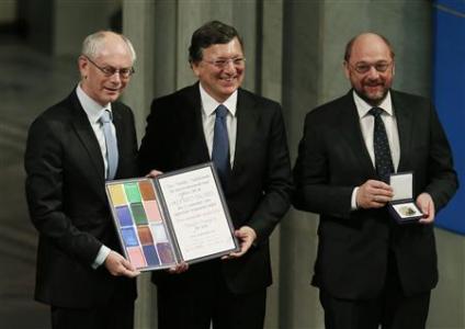 EU representatives President of European Council Van Rompuy, President of EC Barroso and President of European Parliament Schulz hold Nobel Peace Prize certificate and medal after accepting it on behalf of EU in Oslo